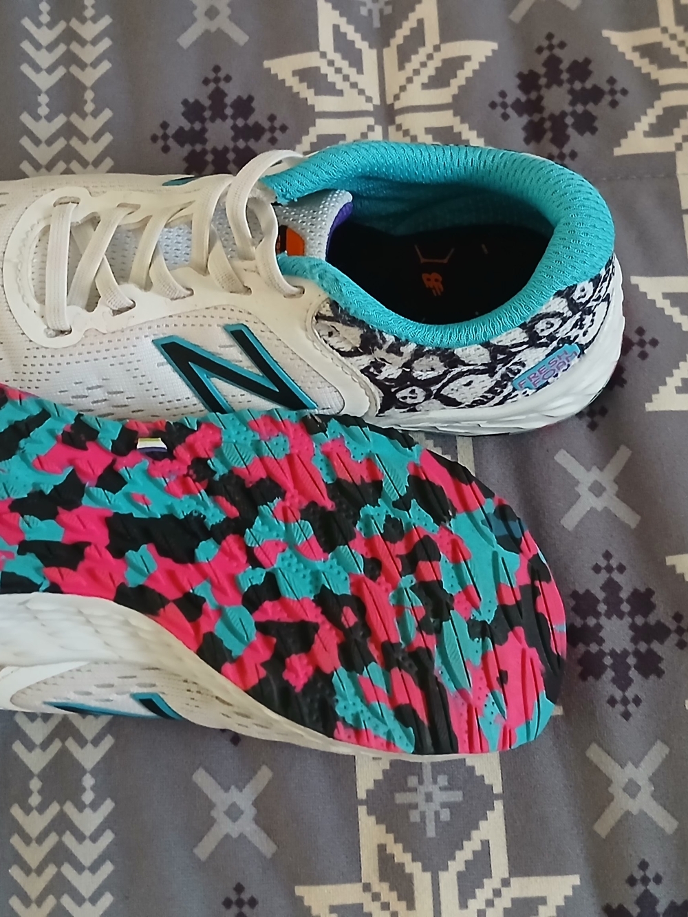 New Balance Women's White Sneakers with Teal and Pink Patterned Outsole